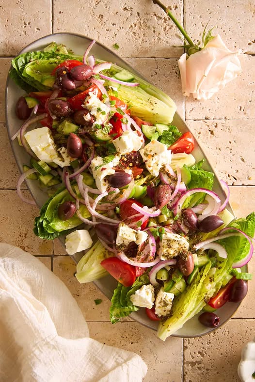 "This Greek Salad recipe is bursting with Mediterranean flavor—packed with fresh vegetables, feta cheese, and olives. The perfect healthy salad for any occasion!"
